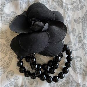 Women’s Black beads with attached flower